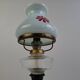 1960s Czechoslovakian milk glass oil lamp style table lamp with red windmill