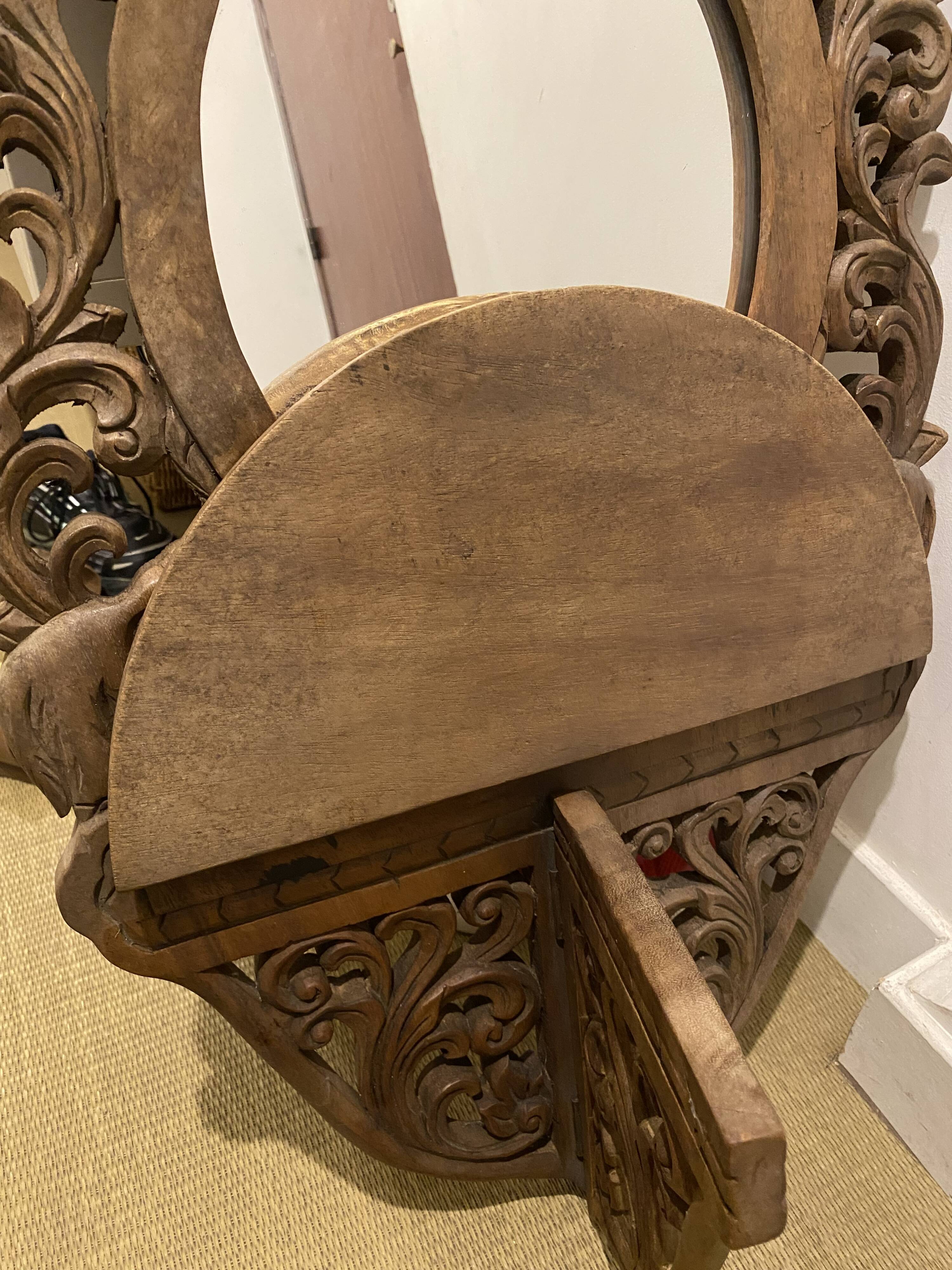 Carved mirror with integrated shelf