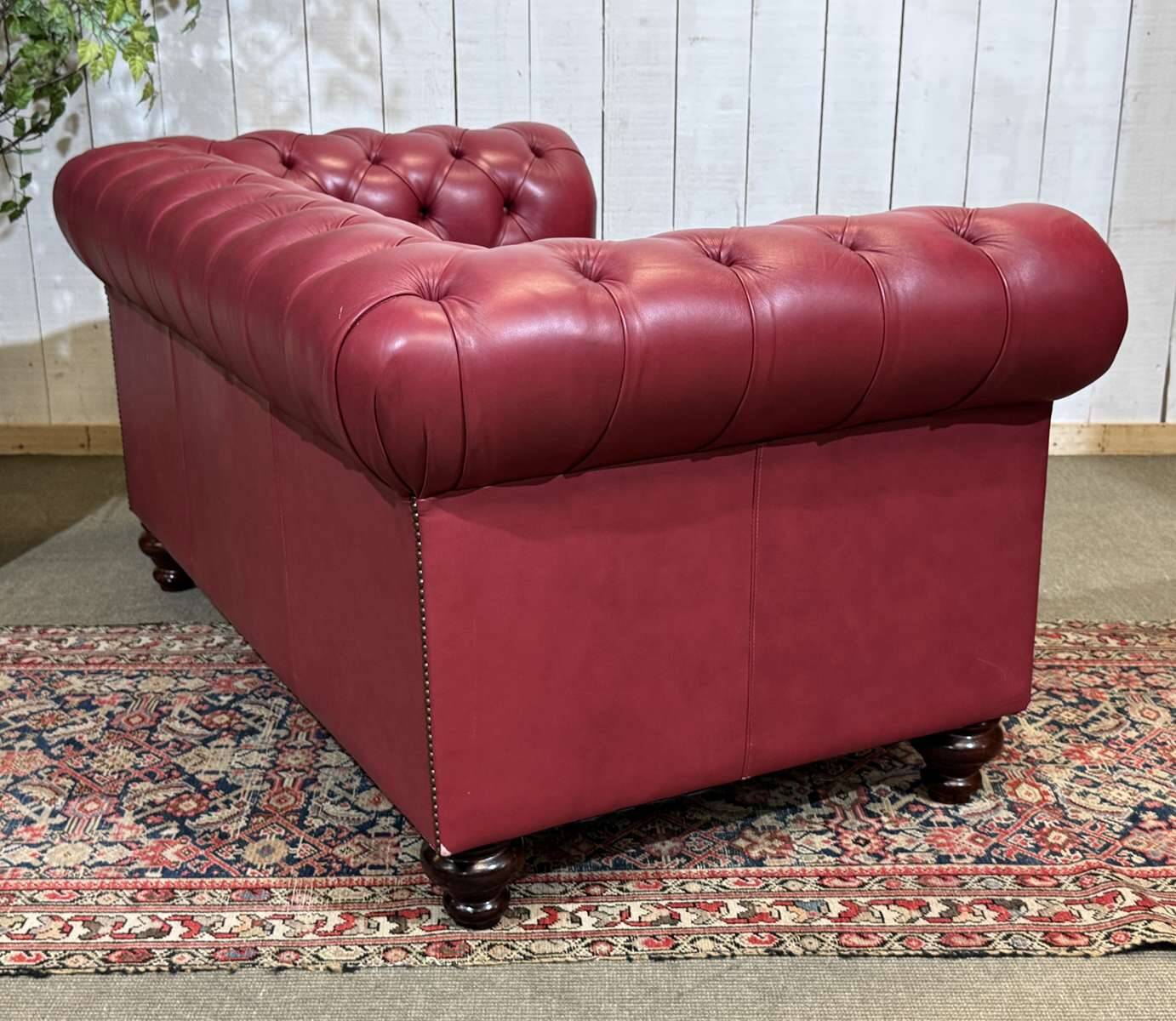 Chesterfield 2-seater leather sofa, modern production from the 2000s.