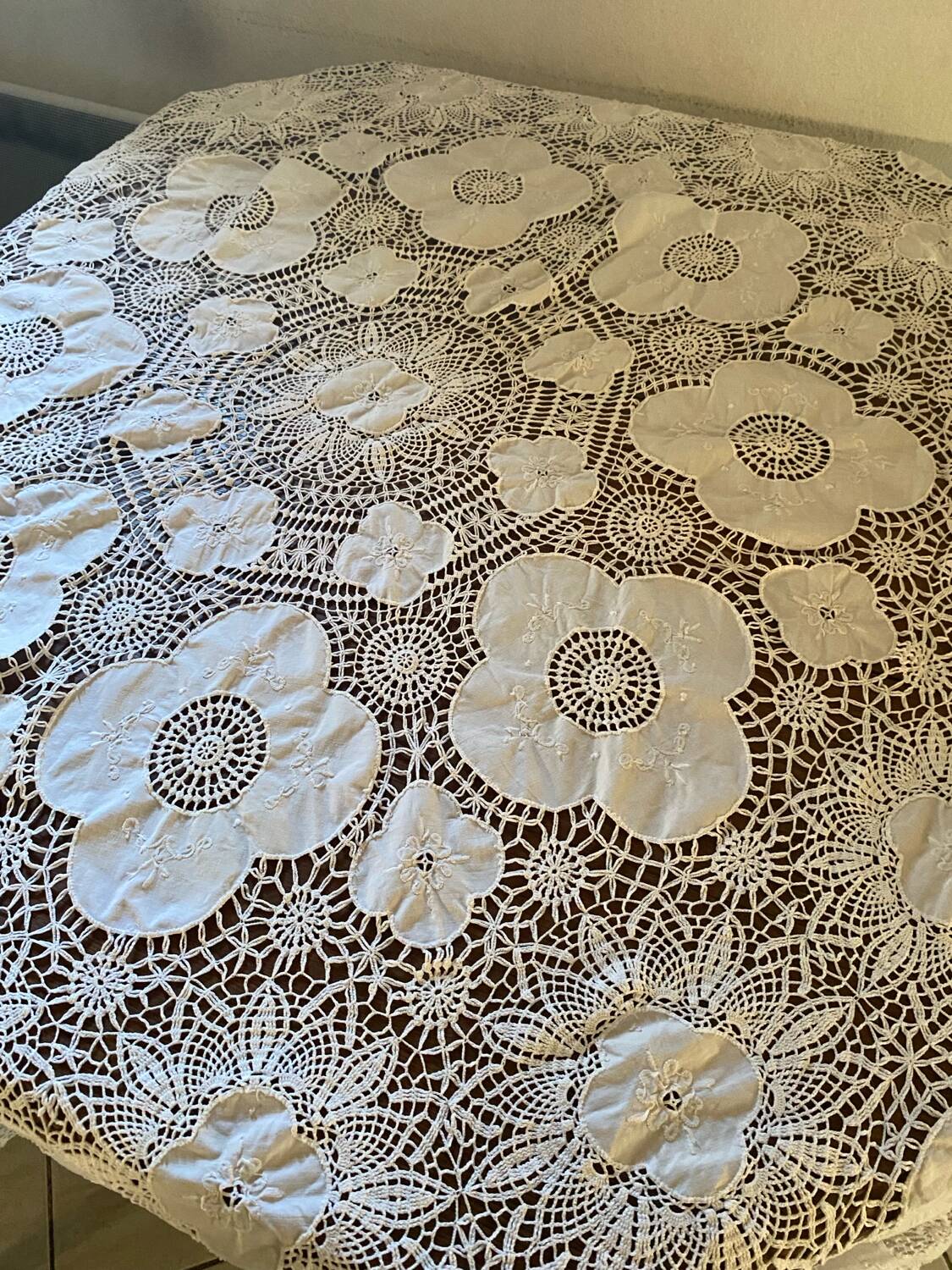 White cotton tablecloth with crochet lace.
