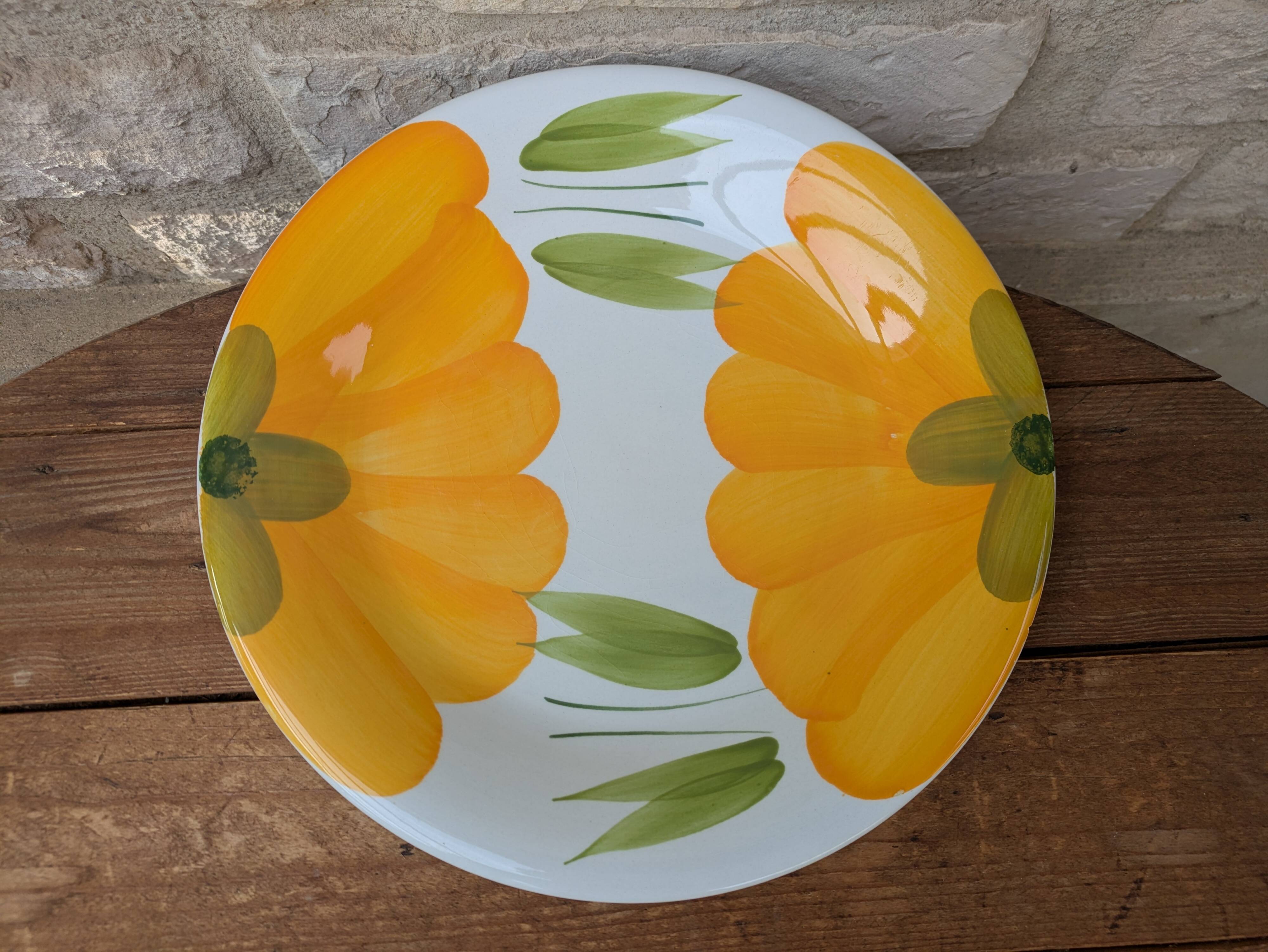 Round serving dish with hand-painted yellow flowers in ceramic TC Italy.