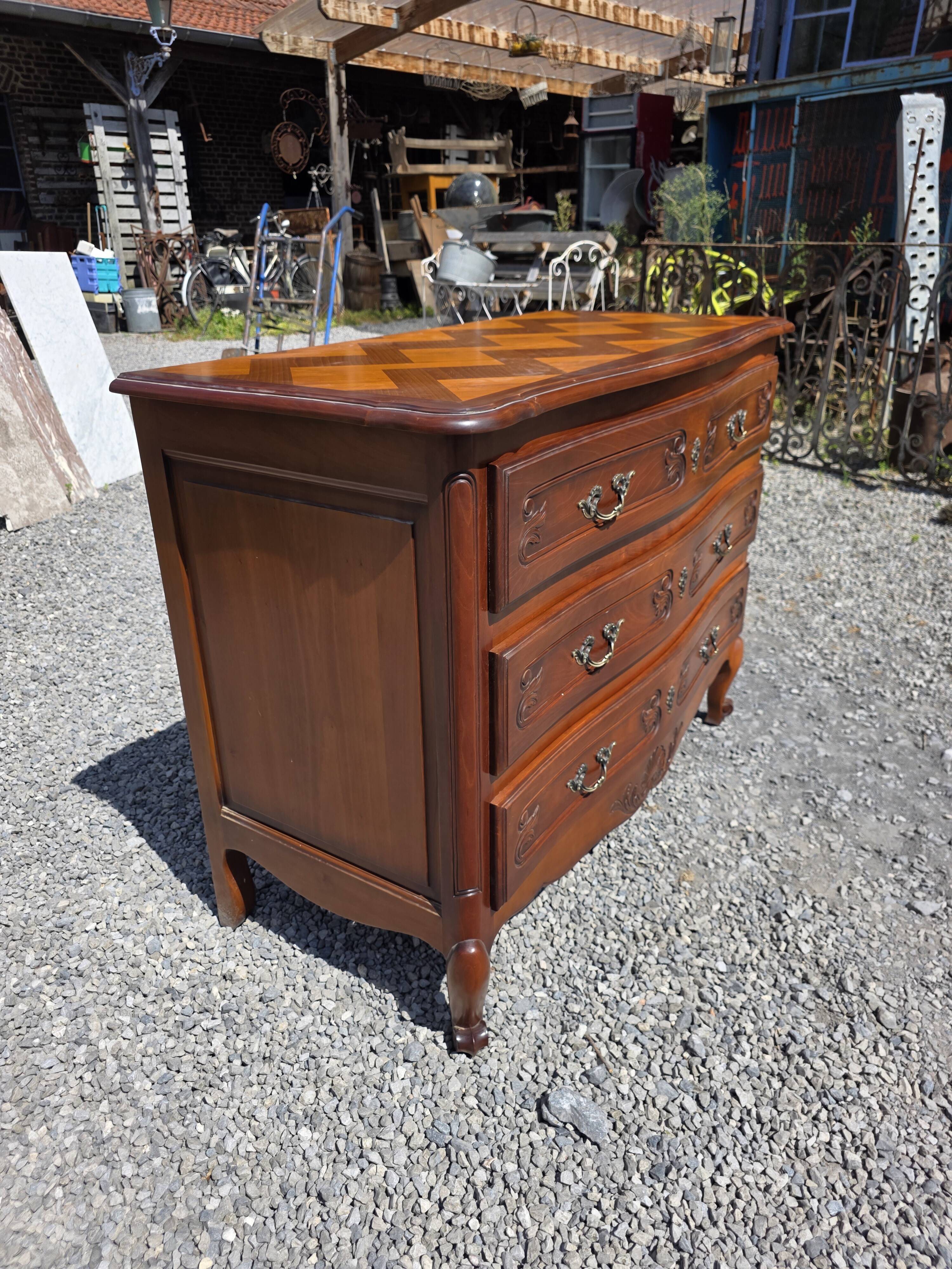 Curved commode in Louis XV style made of cherry wood.