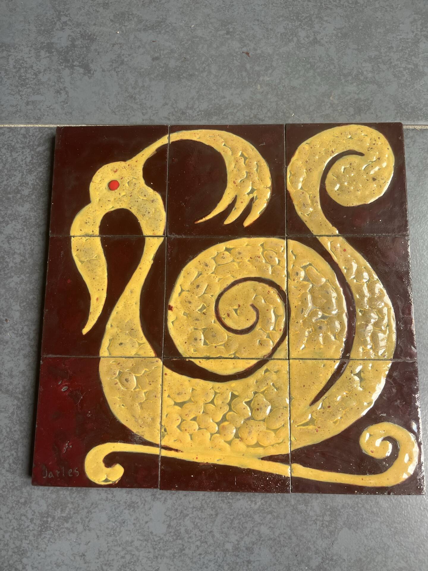 Ceramic plaque with zoomorphic pattern made up of 9 tiles.
