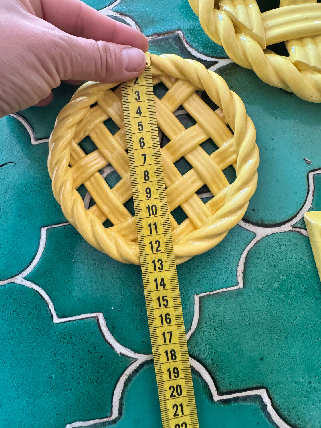 2 yellow ceramic trivets and knife rests