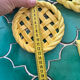 2 yellow ceramic trivets and knife rests