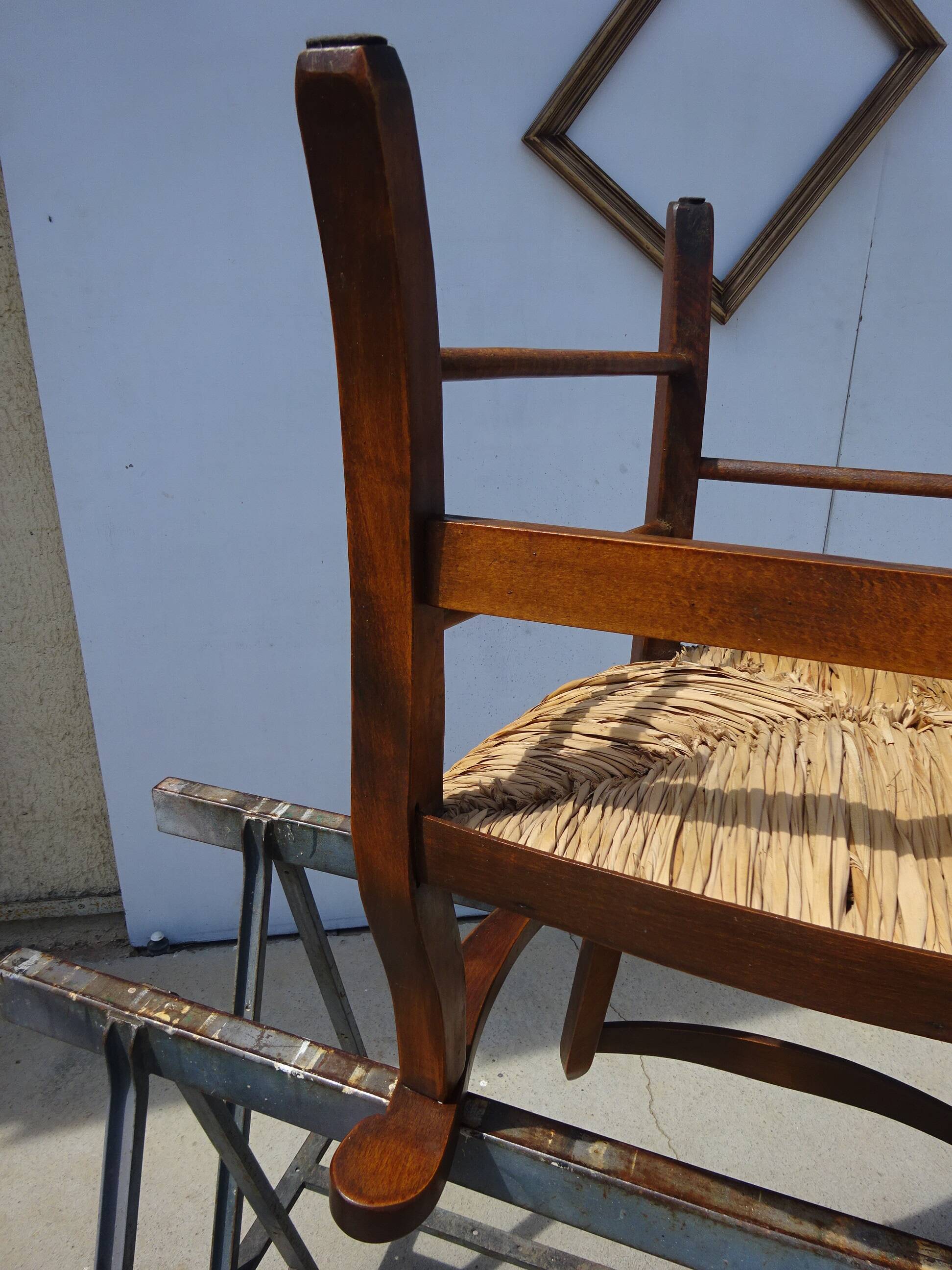 solid wood armchair, straw-covered seat
