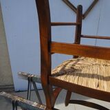 solid wood armchair, straw-covered seat