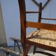 solid wood armchair, straw-covered seat