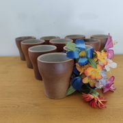 Stoneware cups – Armor stoneware set of 10 and an 11th French stoneware cup.