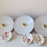 Trio of enameled sheet metal pendant lights