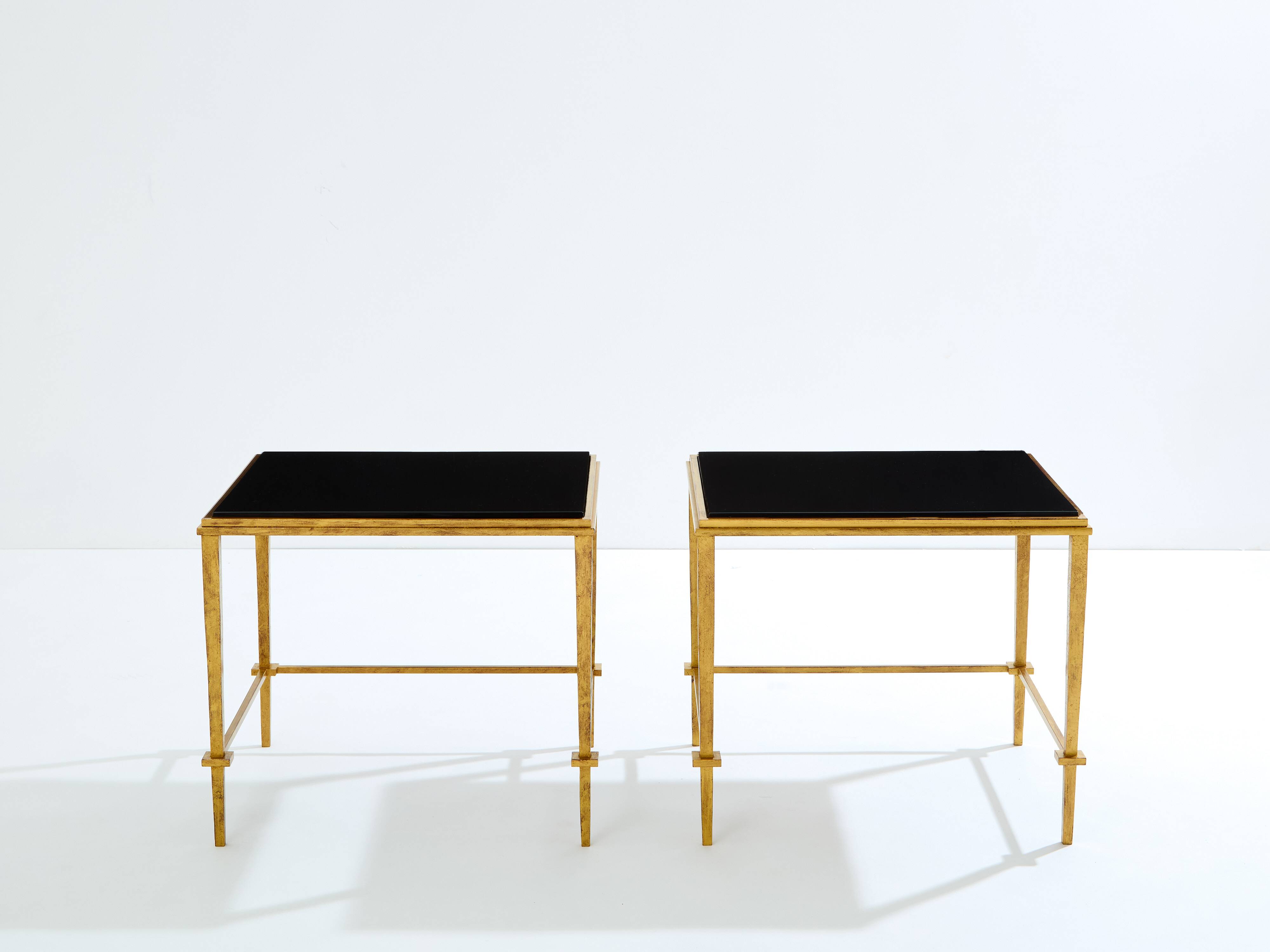 Pair of side tables in gilded iron and black lacquer Maison Ramsay 1950