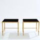 Paire de tables d’appoint fer doré laque noire Maison Ramsay 1950
