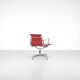 "EA 108" armchair in red leather, designed by Charles and Ray Eames for Vitra,