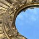 Large sun mirror in carved gilded wood.