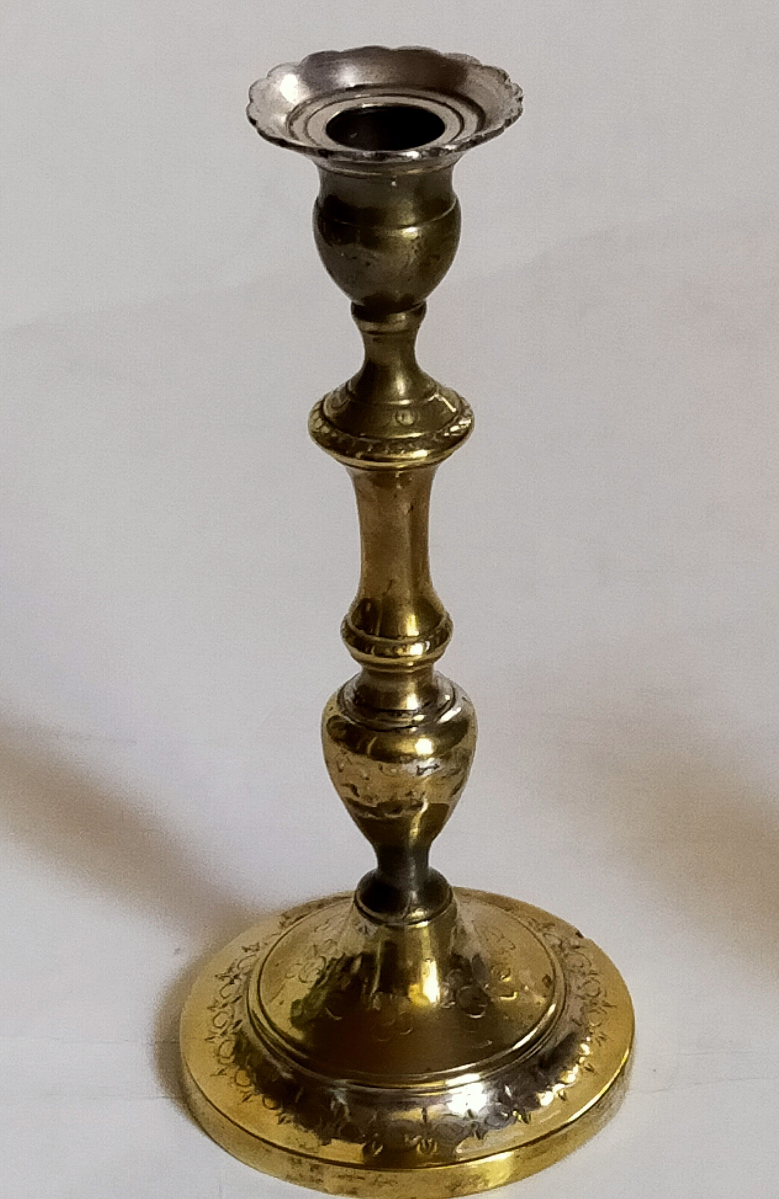 Duo of solid brass and gold metal candle holders worked old