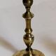 Duo of solid brass and gold metal candle holders worked old