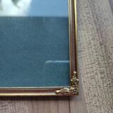 Vintage photo frame in gold and decorated metal