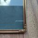 Vintage photo frame in gold and decorated metal