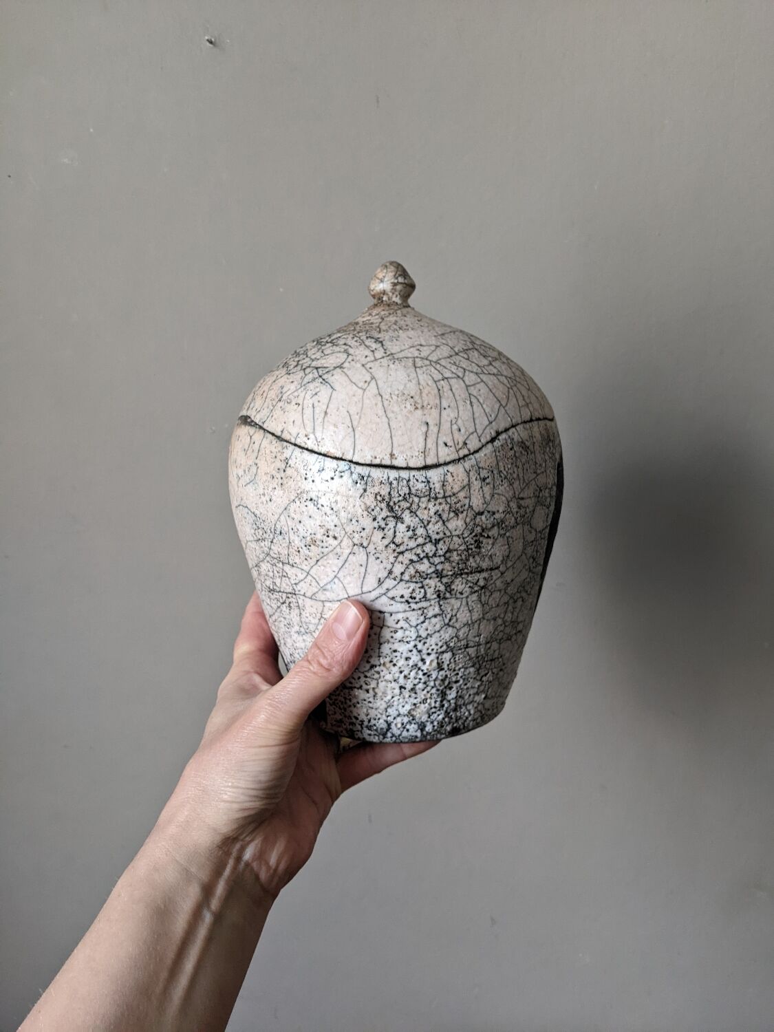 Handmade raku ceramic pot in contemporary Japandi design.