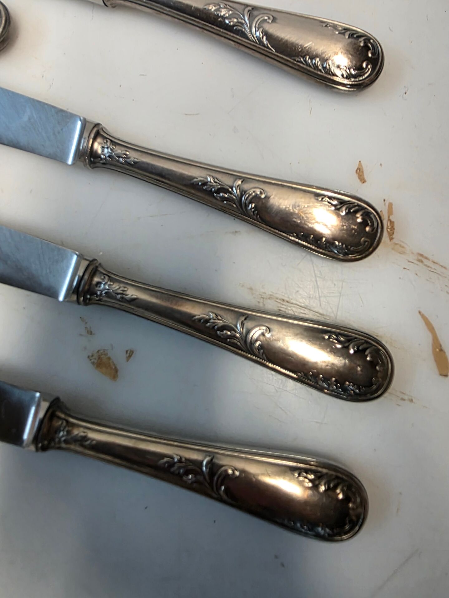 12 silver-plated metal knives from the mid-20th century