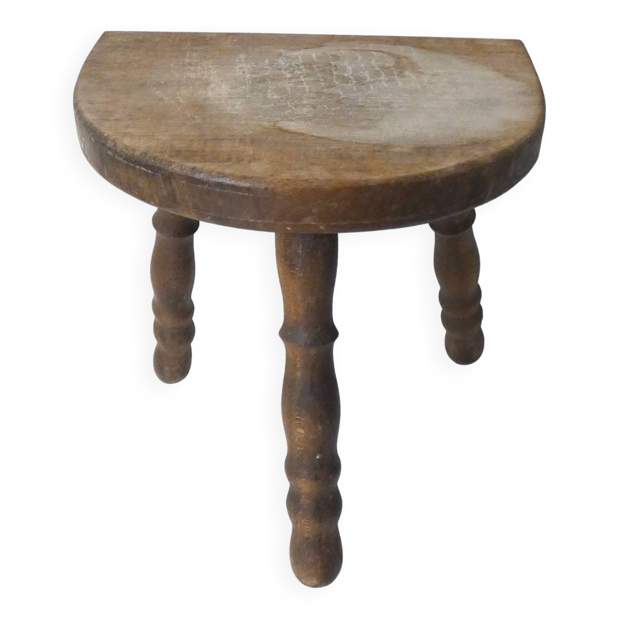 Old milking bench tripod stool in solid wood