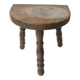 Old milking bench tripod stool in solid wood