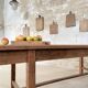 Solid wood workshop table with straight legs.