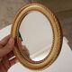 Small vintage oval mirror in gilded resin from the 60s/70s.