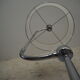 Flexible floor lamp, chrome, opaque white shade with metallic edges.