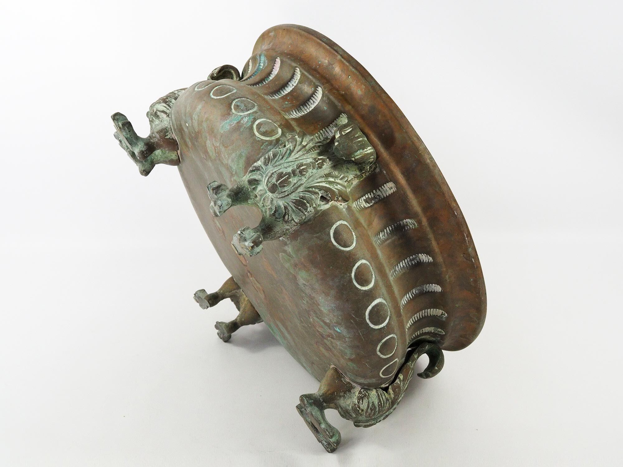 Repelled copper planter with acanthus and cast bronze legs, 1900s