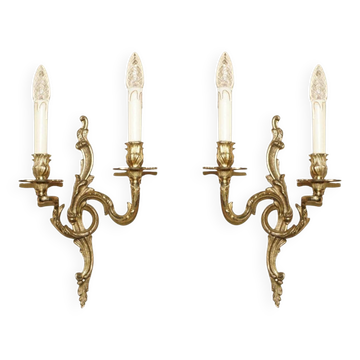 Pair of antique wall sconces from the 1920s in gilded bronze.