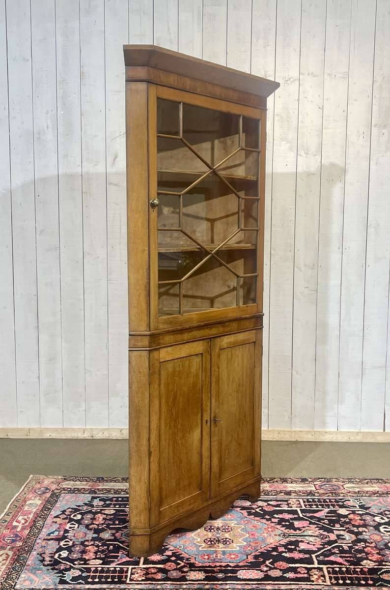 19th-century English corner cabinet in oak, mahogany, and fir.