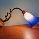 Wall light in gilded bronze and blue marmoreal glass, early 20th century