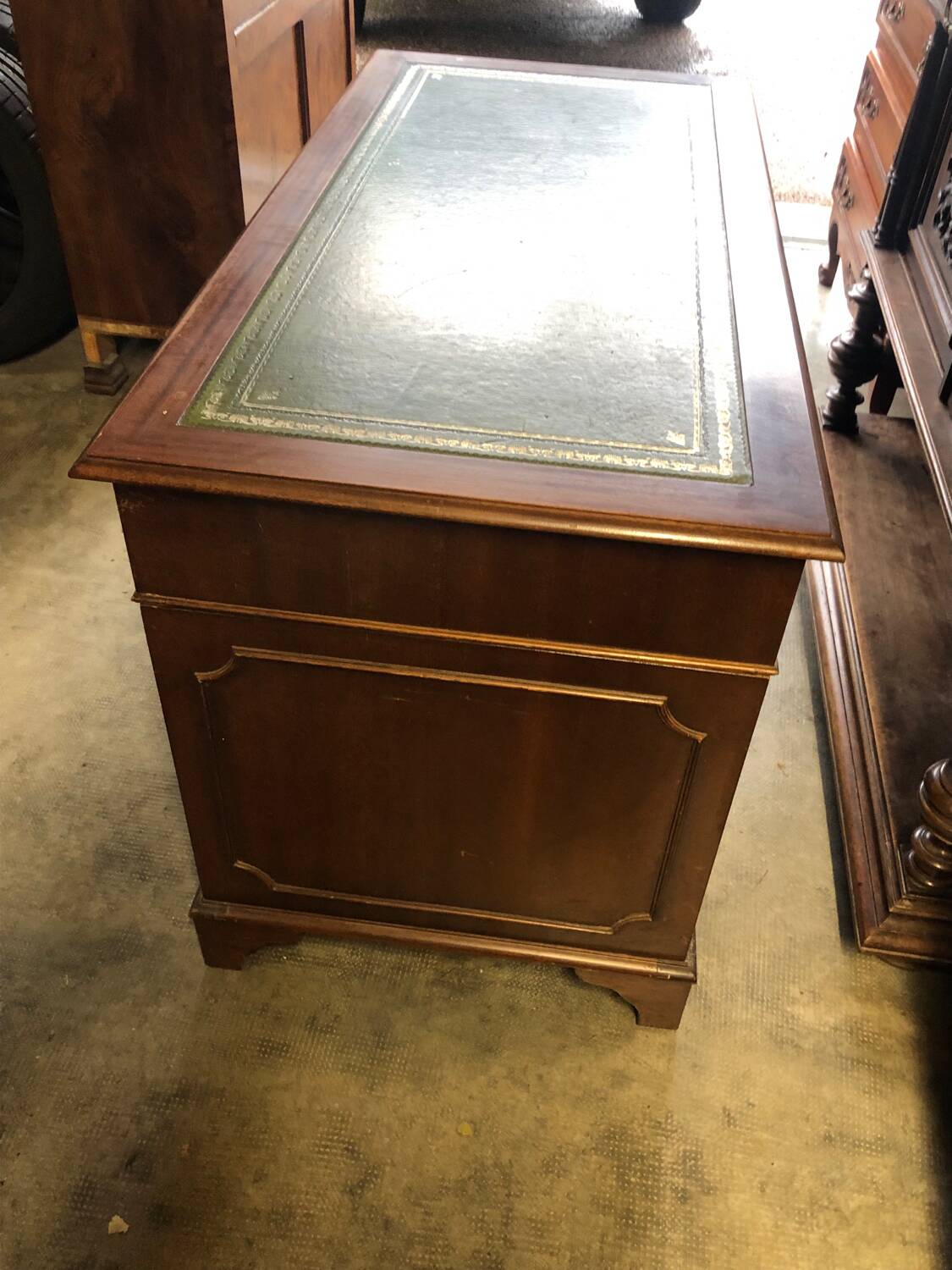 English pedestal desk with green leather top