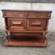 Henri II style console table with a red marble top.