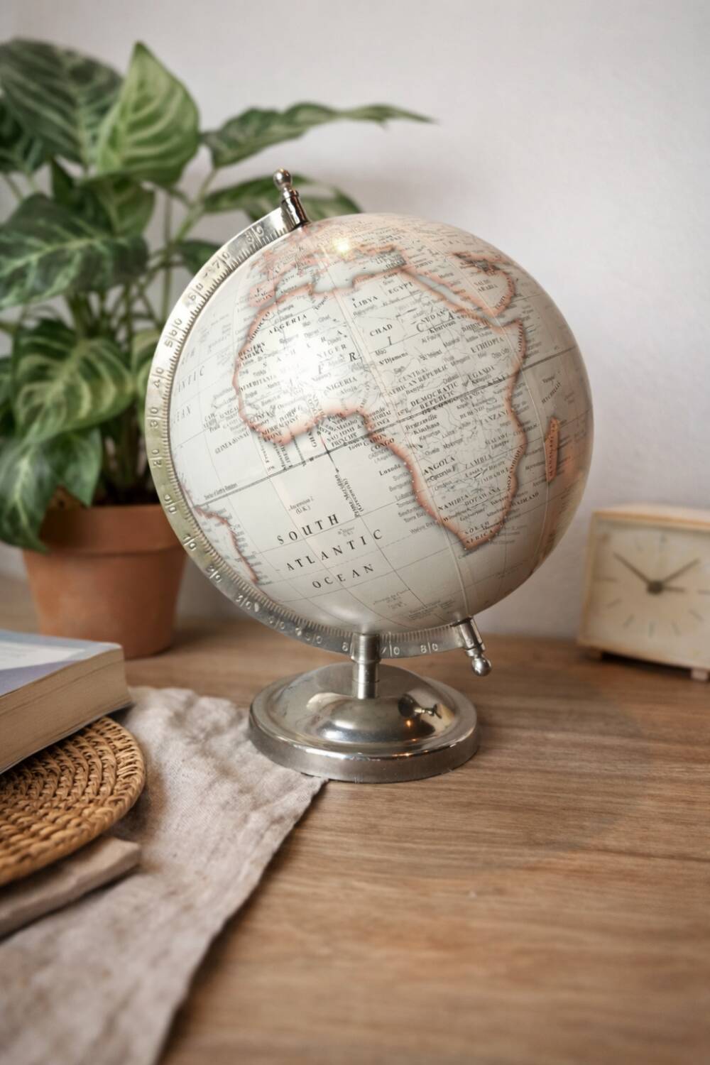 Decorative terrestrial globe on silver metal stand – explorer style
