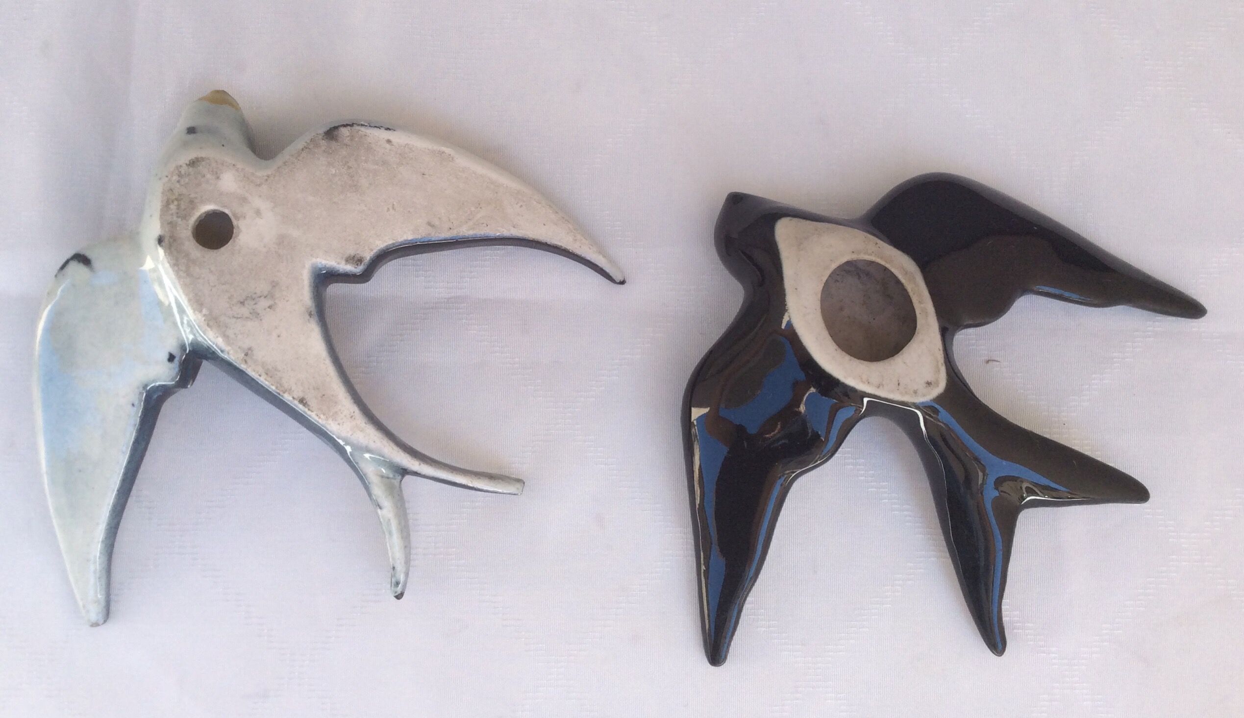 Two ceramic wall swallows