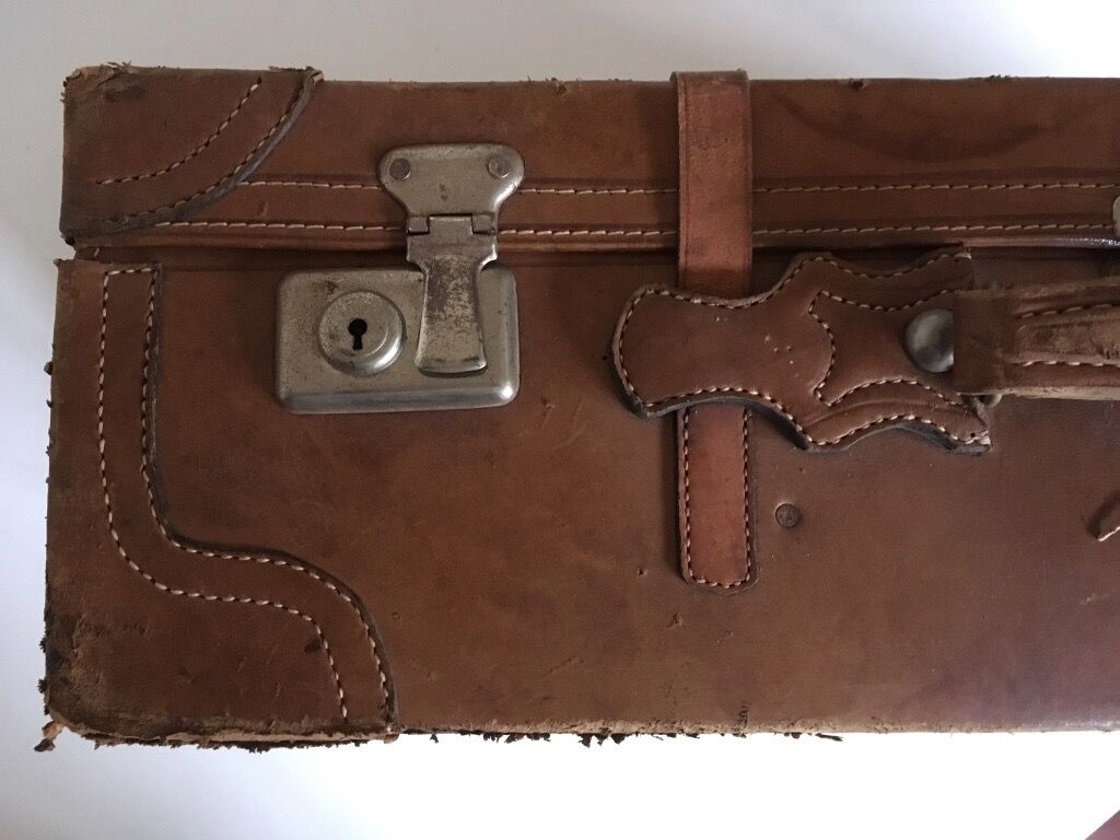 suitcase of leather with labels of palaces