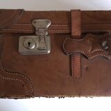 suitcase of leather with labels of palaces