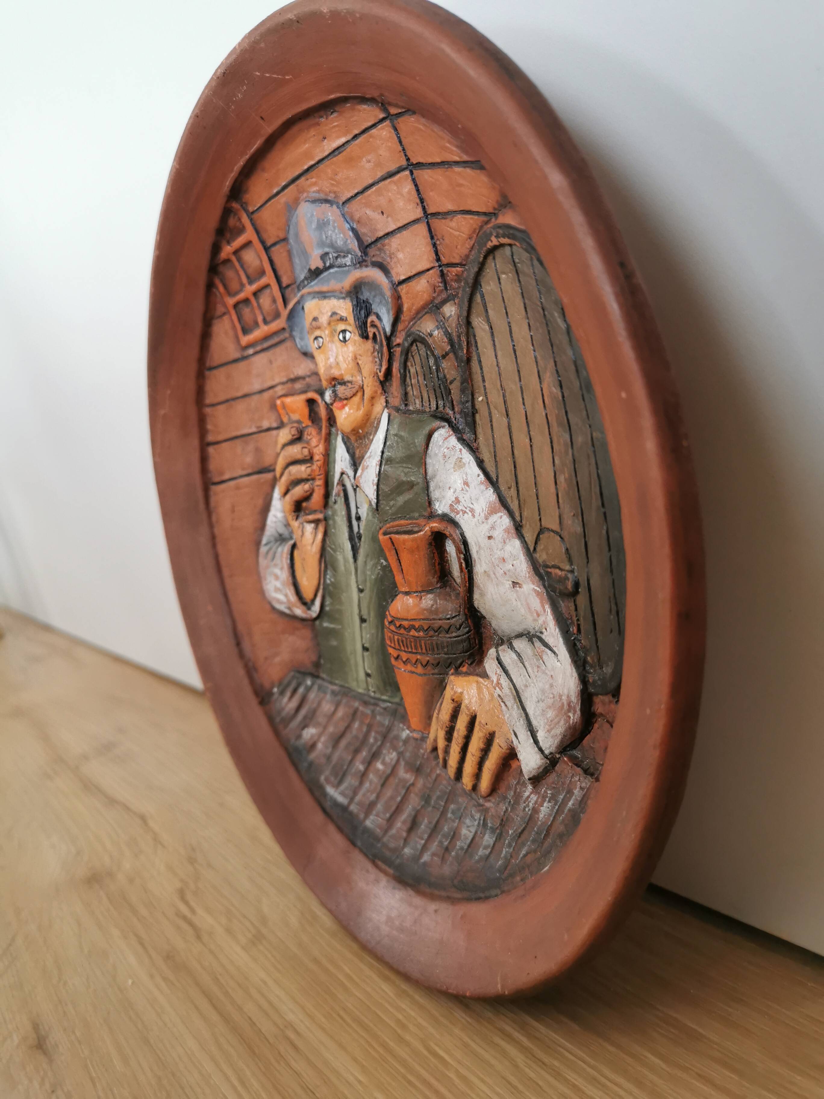 Vintage Embossed Clay Plate: Man Drinking, Retro Wall Decor