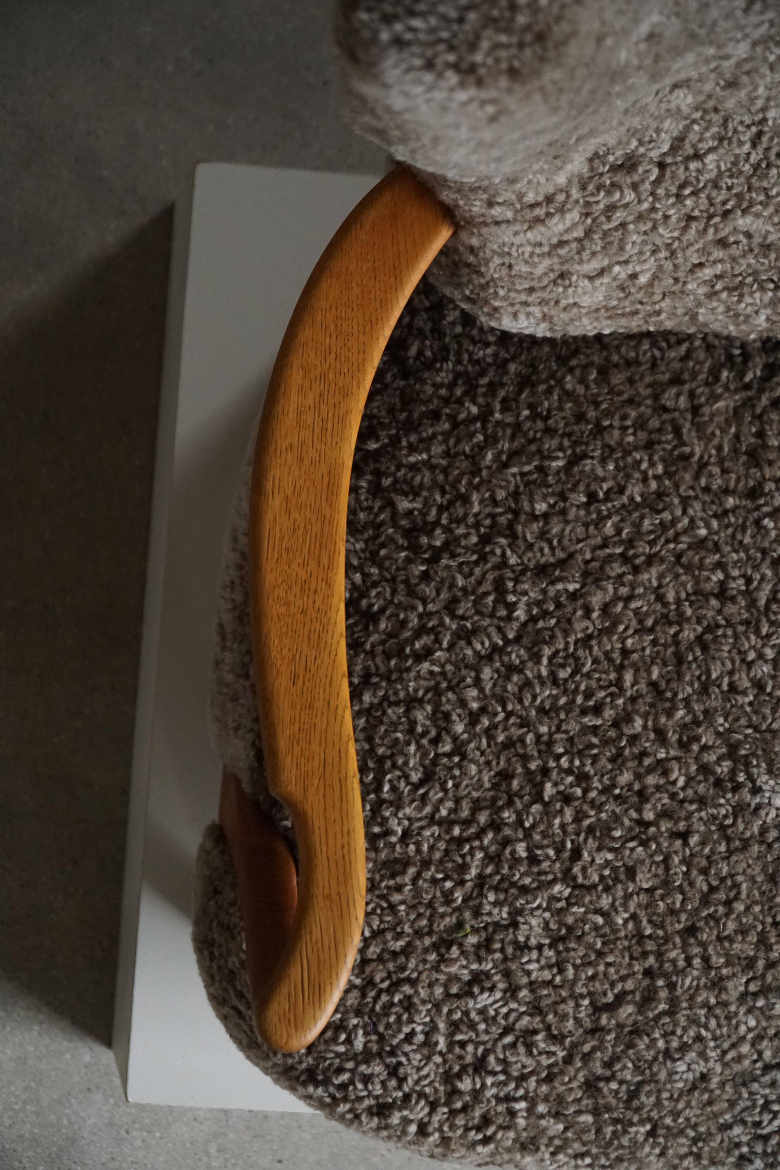 High-backed chaise longue in oak and lambswool, Danish Modern, Viggo Boesen, 1950s.