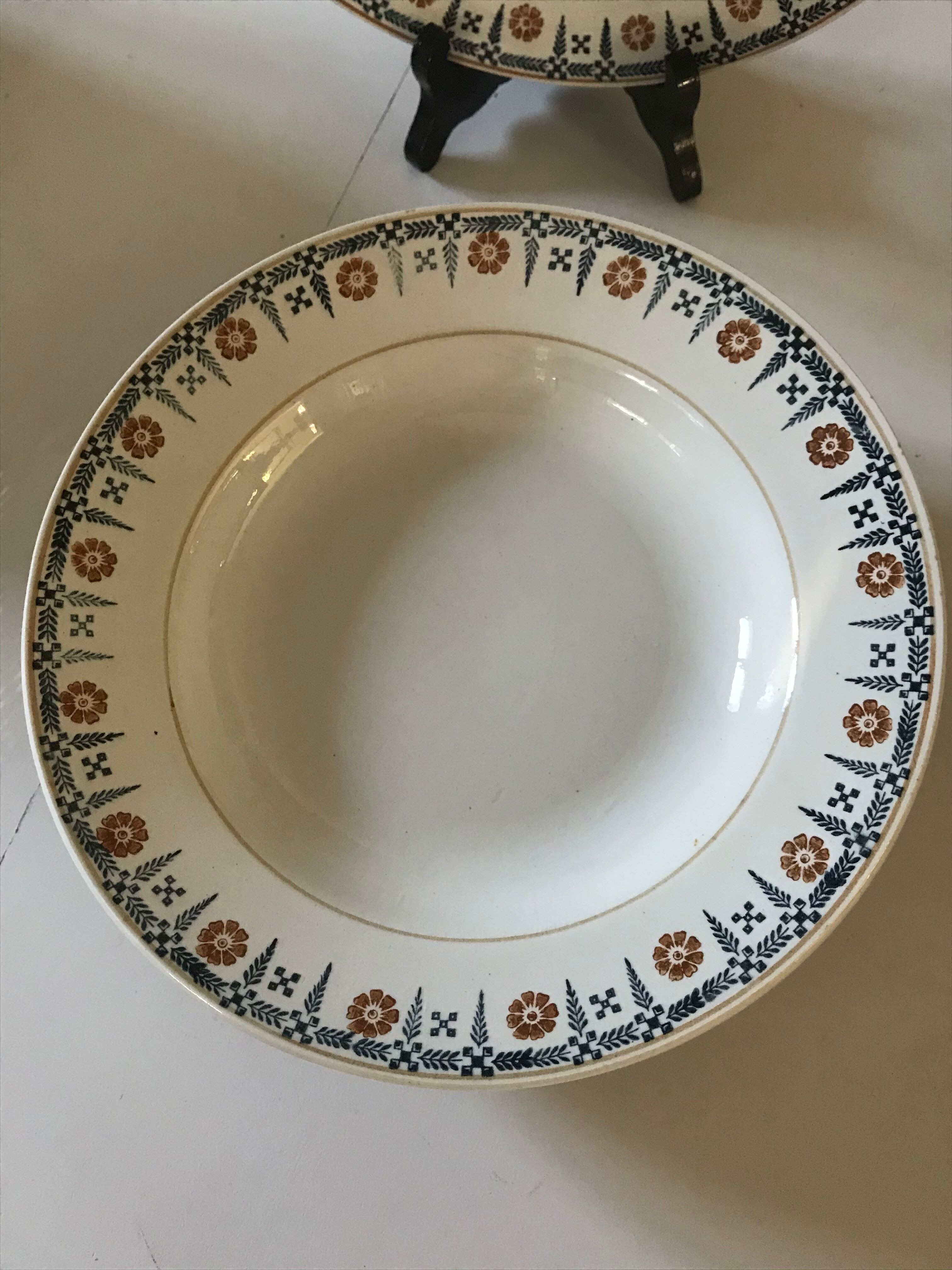 Set of 9 Saint Amand hollow plates