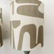 Pair of wooden lamps with custom modernist lampshades.