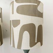 Pair of wooden lamps with custom modernist lampshades.