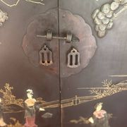 Magnificent black and gold lacquered Chinese cabinet.