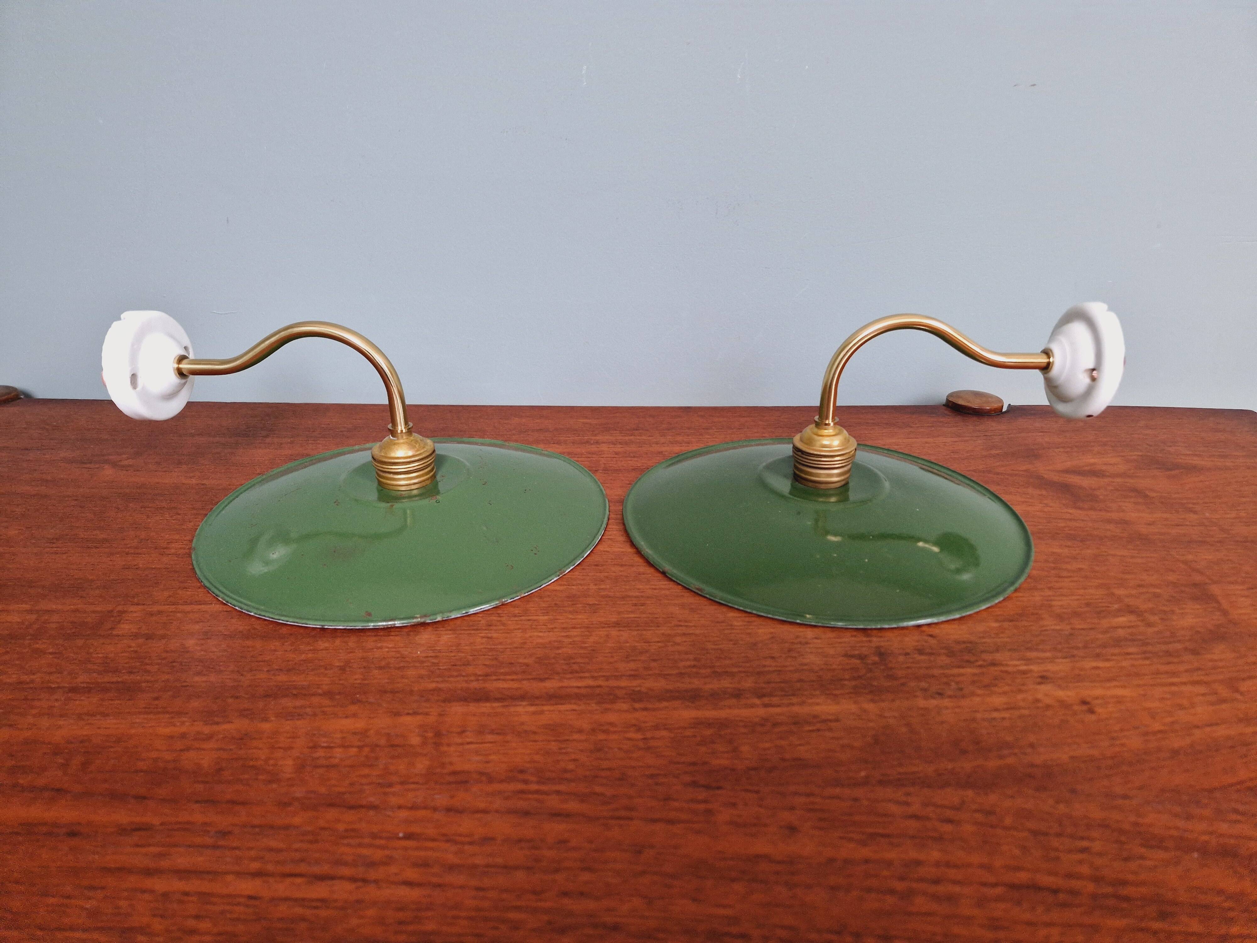 Pair of industrial wall lights in brass and green enameled sheet metal
