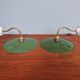 Pair of industrial wall lights in brass and green enameled sheet metal