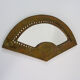 Old wall mirror in the shape of a copper fan pushed back, year 70