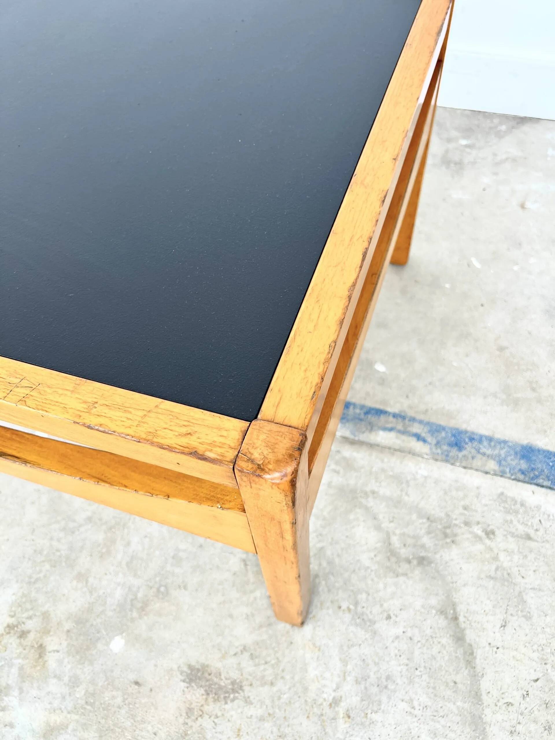 Baumann coffee table with black medium-density top