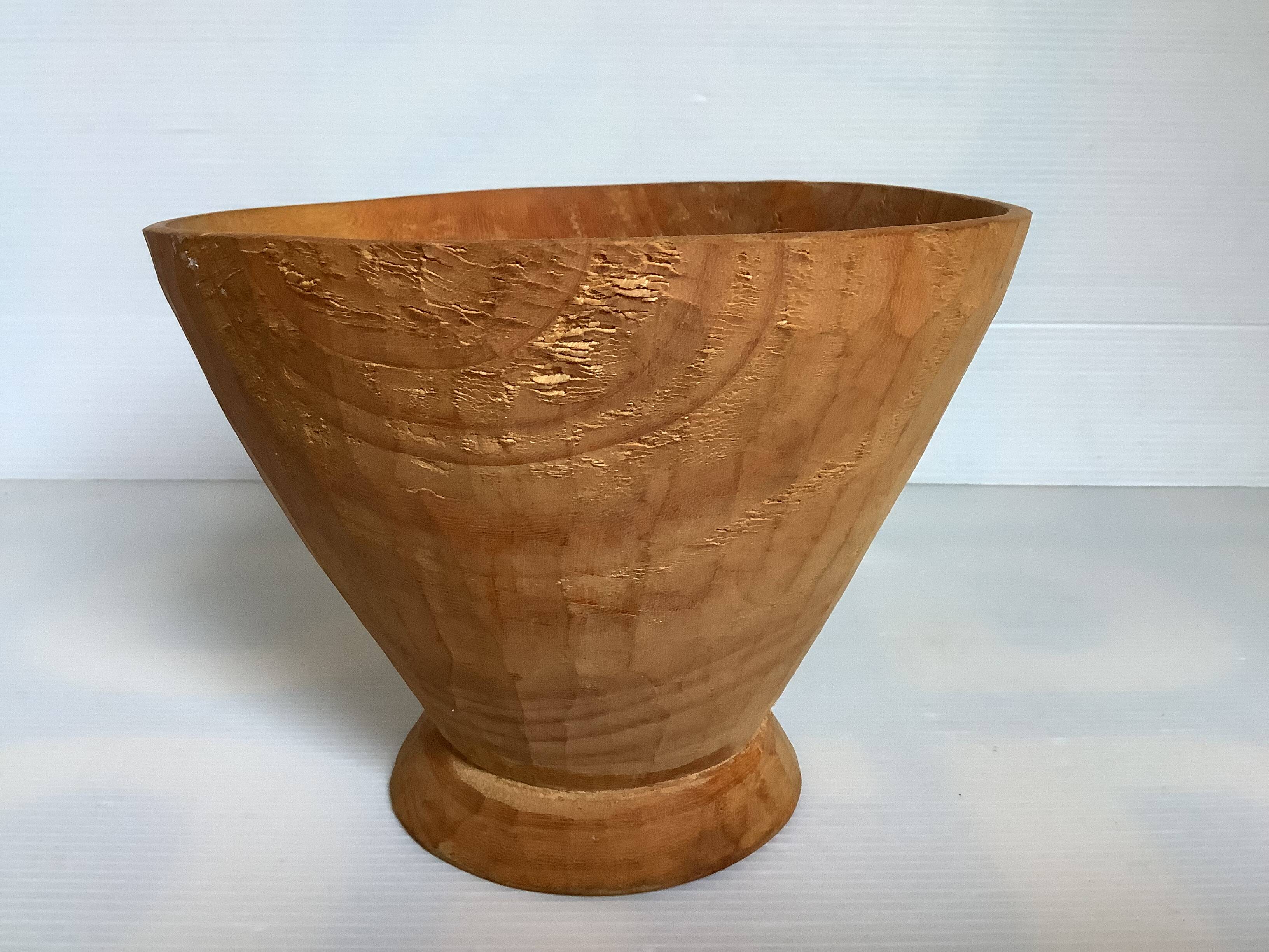 Asymmetrical wooden sculpted catchall.